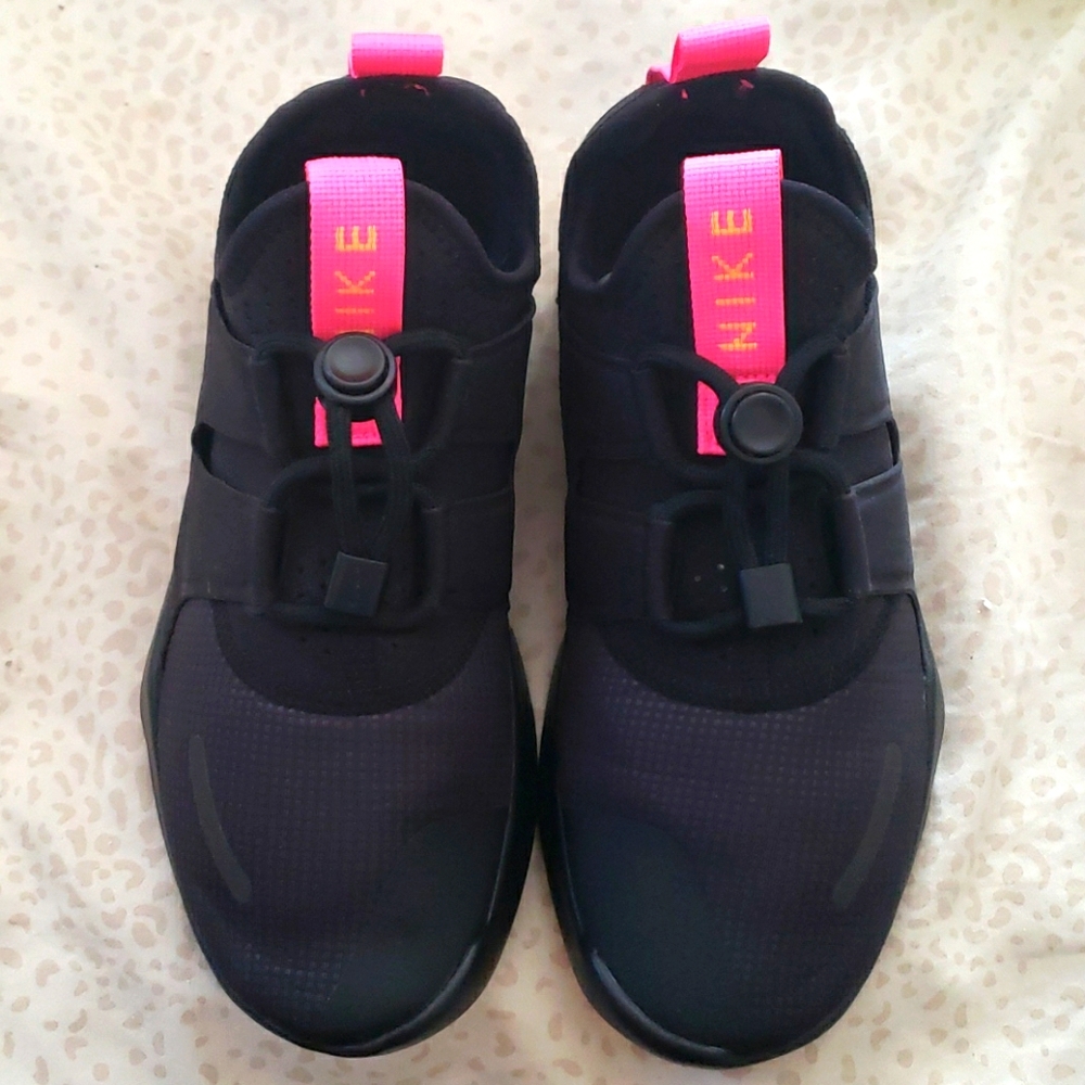 NIKE black and pink speakers
